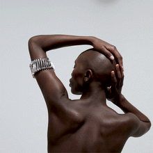 Load image into Gallery viewer, back view model safety pin arm band over white background animated gif
