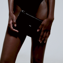 Load image into Gallery viewer, front and back view black leather swing clutch bag animated gif
