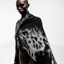 Load image into Gallery viewer, close up view model in safety pin cape over white background
