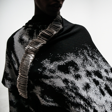 Load image into Gallery viewer, close up view model in safety pin cape over white background
